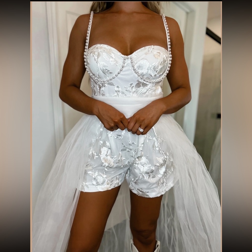 NWT from the boutique Punchy Blonde. Wedding romper in a size Large!
